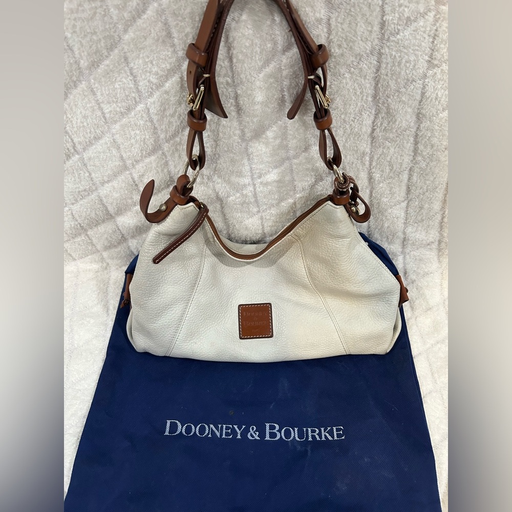 Dooney and Bourke White and Tan leather shoulder bag.